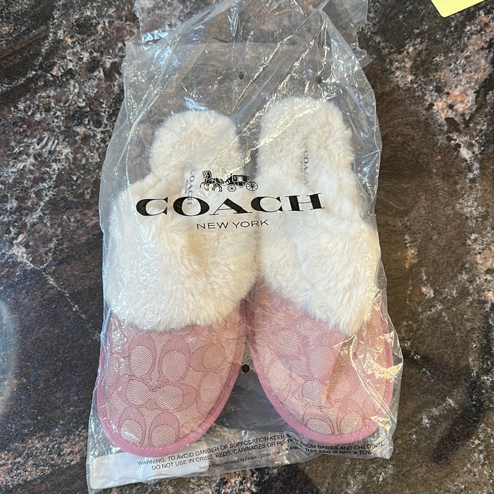 Coach slippers size 8 pink signature brand new in package never worn.